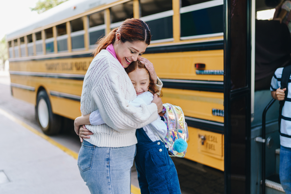 Mom with daughter at the Bus Stop