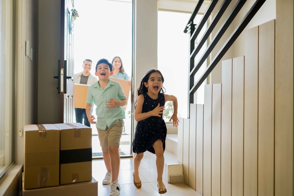 kids running into a new home