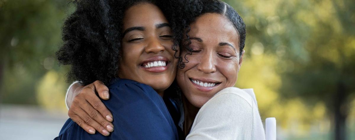Two women hugging