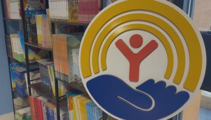 United Way logo near ReadingPals books